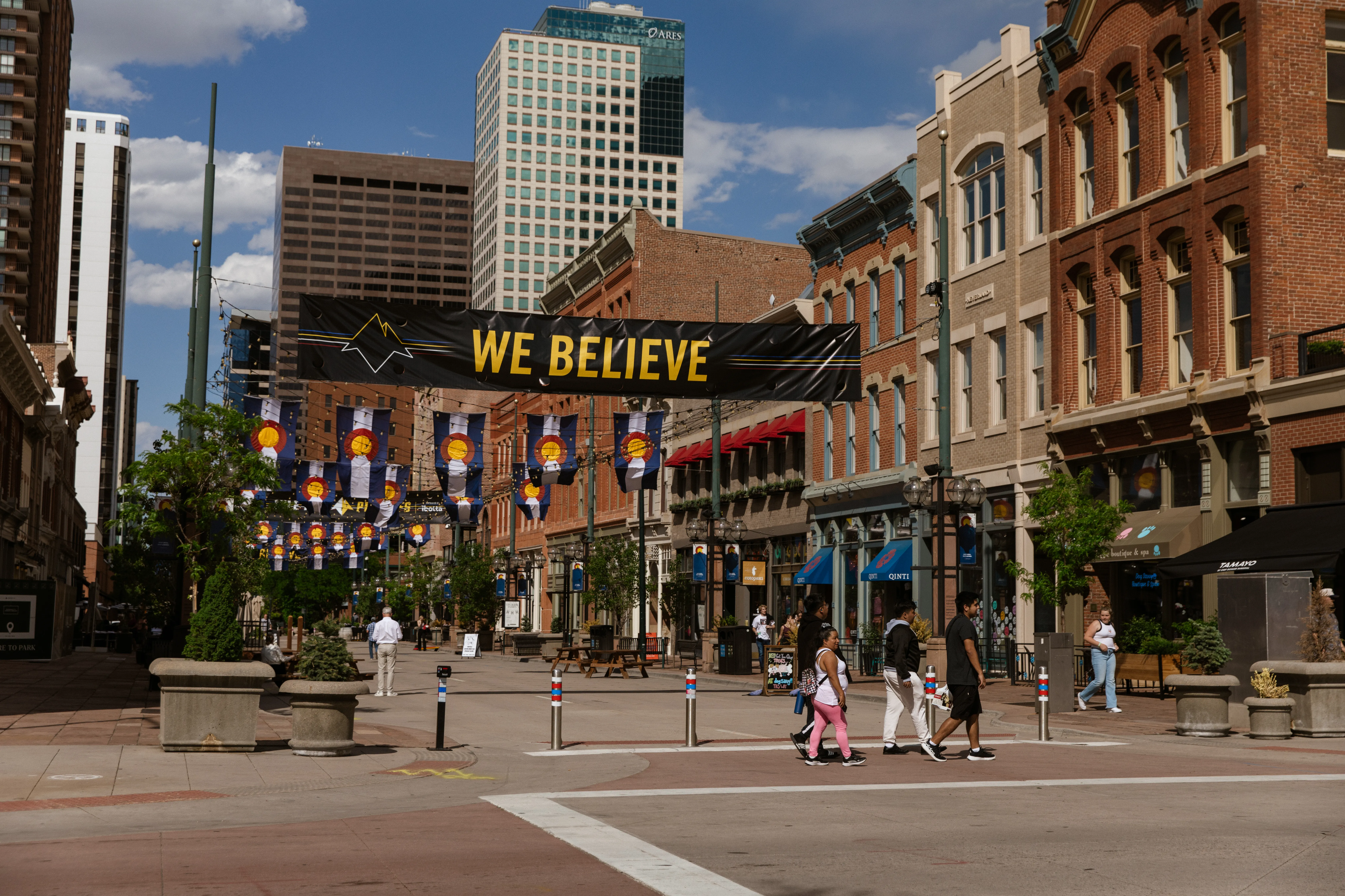 We Believe banner at the end of Larimer Square
